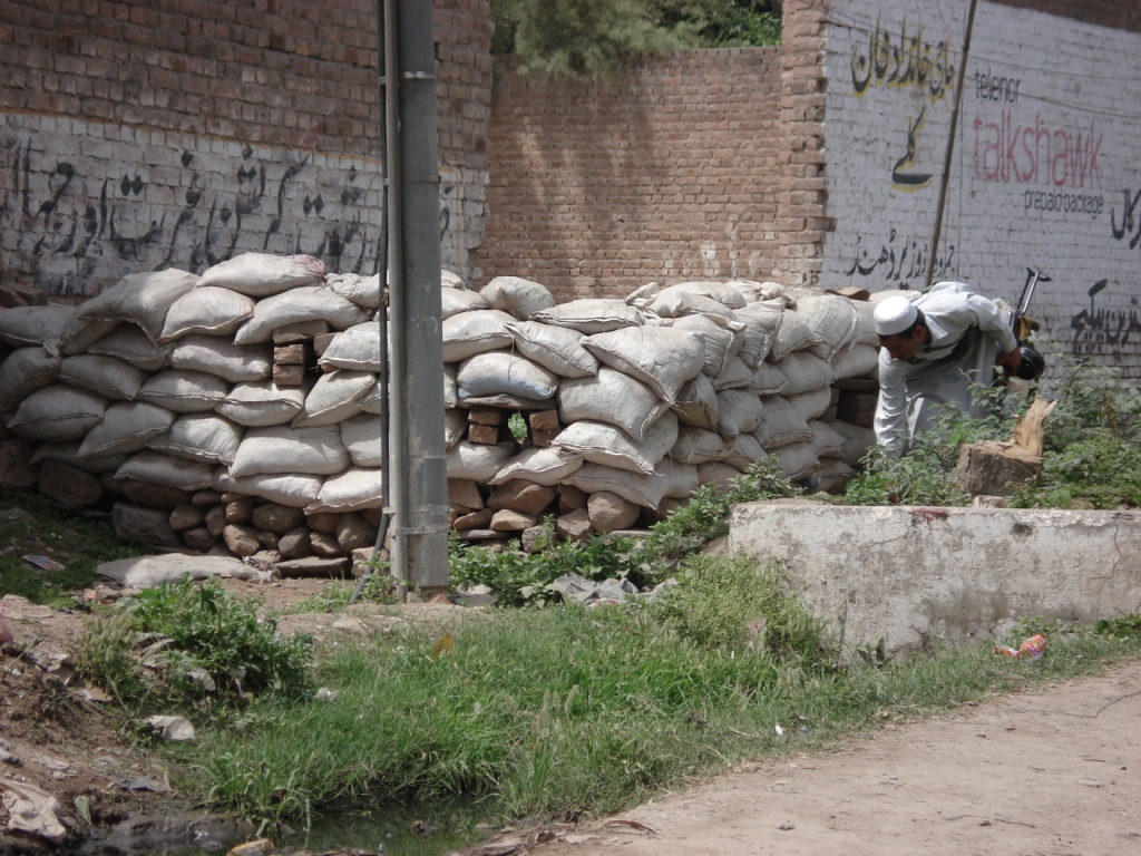 Tribal fighter at his post two feet off the main road. The compound he is guarding was attacked two days prior to our last trip to the Khyber