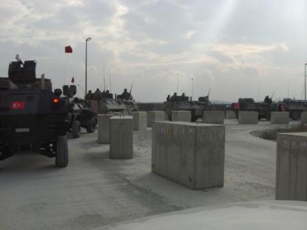 Here is a Turkish Army convoy heading into a FOB behind a convoy of French paratroopers. The Turks never drive fast, mix in with the local traffic and do not man turret guns in the capitol. The Afghan civilians like the Turks a lot and go out of their way to point out the difference between how the Turks operate when compared to American, British, and French forces. A head of this group were two truck loads of Norwegian Special Forces who travel like I do in unarmored local vehicles. If I had gotten a picture of them and posted it I suspect I'd be inundated by requests from young women to come intern with Free Range International. The guys looked like young Vikings and they should be out with us doing good deeds daily rather than forced to sortie for a large FOB