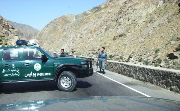 The bad guys fired on Karzai's convoy from the high ground to the right.  There are ANA soldiers stationed on in the hills to the left.  The shooter bpicked out the largest, newest SUV in a 12 vehcile convoy and hit it repeatedly from way up the hillside.  That normally takes a machinegun on a tripod with a T&E mechinsim and some stubby pencil math.  You have top dope the gun for the elevation drop - lining up the sights will not work becasue the fall of shot is not a straight line.  This was either some exceptionally good machinegunning or a very lucky shooter.  Remember the ANA is on the adjacent hill not 300 meteres away when the shooter opened up.  Karzai's brother - demonstrating better judgement than most Afghan VIP's was not sitting in the brand new SUV.