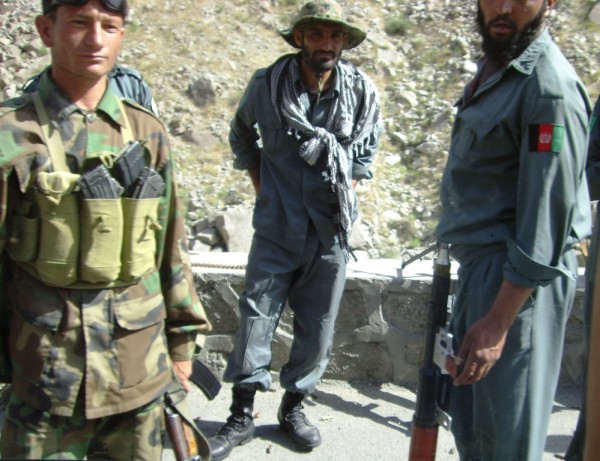 One of the few pics I was able to get because Misael was being such a sissy - you can see the expended brass at these ANP troops feet.  The fighting was long over by this time but the police were still insisting that traffic move along smartly