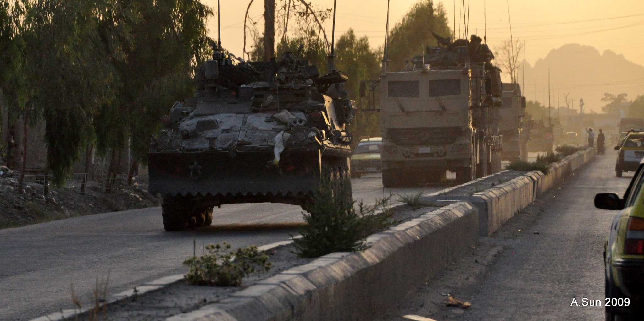 Canadian armor rolling through downtown Kandahar