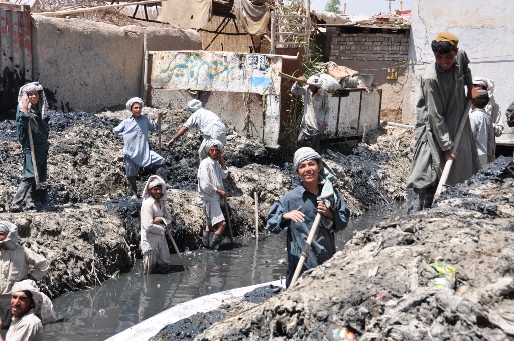 Cleaning the central canal in Kandahar City - not the most pleasent work but it pays well