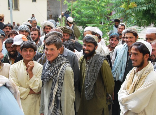 Panjwayi Tim (cropped out on his request) rapping with some of the workers in Pashto. The locals are always happy to hear us trying their difficult language.