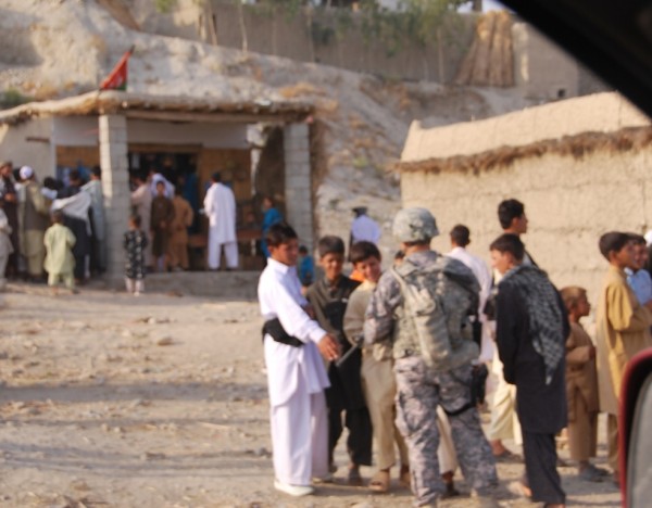 A joint Afghan/American Army visit to a village on the Jalalabad/Kabul road on the second day  of EID.  This is a step in the right direction but in and of itself too little too late.  The local American training team should be stopping in villages and chatting up folks every day all day.  In  the 26 months I have been living in Jalalabad this is the first time I have seen American soldiers off their vehicles and talking to local people.  This is EID - these guys should bring boxes of dolls and water guns, a sheep, and some soda; take off the helmets and body armor and spend a few hours having water fights with the kids while the adults cook up the sheep.  That is how you gain traction in a local area - there are no shortcuts, no gee whiz technology which allows the grunt work to be accomplished back at the fob by desk bond fobbits.