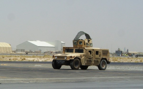 This is the typical use of small NATO forces from the Baltic countries.  These guys sit on the runway at Kandahar all day, every day to keep an eye on traffic coming out of the commercial side of the Kandahar Airport.  It was around 125 degrees when this picture was taken last summer.  This is all this unit will do for the duration of their time in Afghanistan although I think this country has resposnibility for some of the entry control points too. We need people off the FOB's...do you know how expensive it is to keep military units deployed here to do this kind of make work?  Under what circumstances can you imagine that the men and or woman in this vehcile would actually start shooting with that machinegun?  They are facing an internatioanl air terminal for chrst sakes...what a waste of money, time and manpower.