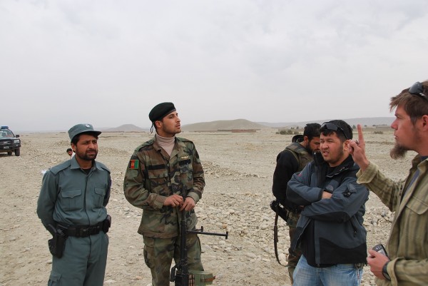 We found the joint patrol a few miles away where they were searching every vehicle and all passangers heading towards Jalalabad. They said six men were in the field pictured above with a cell phone and that they had command detonated the IED. The patrol turned around and engaged the men who ran off and they found another IED which they said "was just an IED" and they weren't sure where it was at the moment. The machinegunner spoke pretty good english and they were running a very professional checkpoint. The kind of IED attack they described is indicative to us of IED makers who want to turn in product to the military for cash.