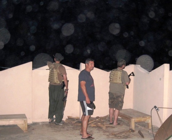 The boys standing to on the roof of the Team Canada safe house. Of course I did not have my good camera so this shot looks like crap. The four expolsions bracketed this house on three sides and were very close.