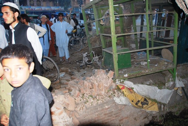 The evening after the IED attack crowds were still gathered at the point of origin