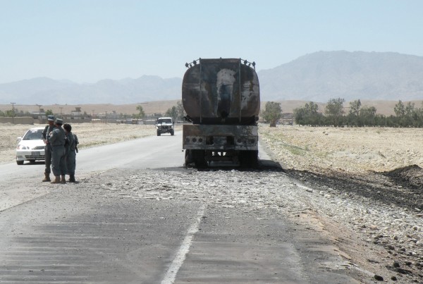 28 May - Two men on a motorcycle attach a limpet mine to the back of this truck but.......