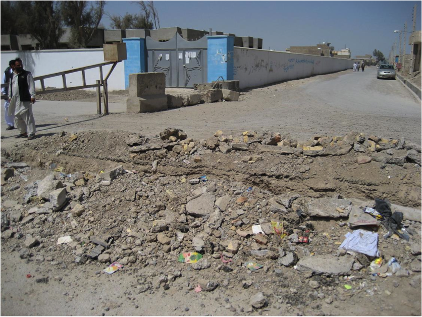 The first group of attackers dismounted here due to road construction and assaulted through the gate. The first attacker detonated his vest here killing the ABP guard at this gate.