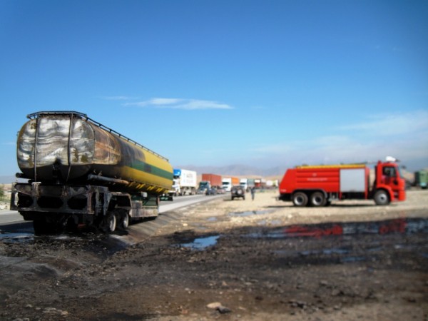 Last Tuesday morning I looked out from my office window to see the clear signature of a tanker attack on the Jbad truck by-pass.  It turned out to be a magnetic mine- the trucker disconnected from the fuel tanker and pulled away allowing the Jalalabad Fire Department to extingish the blaze in less than 15 minutes - note the brand spanking new fire rig in the background