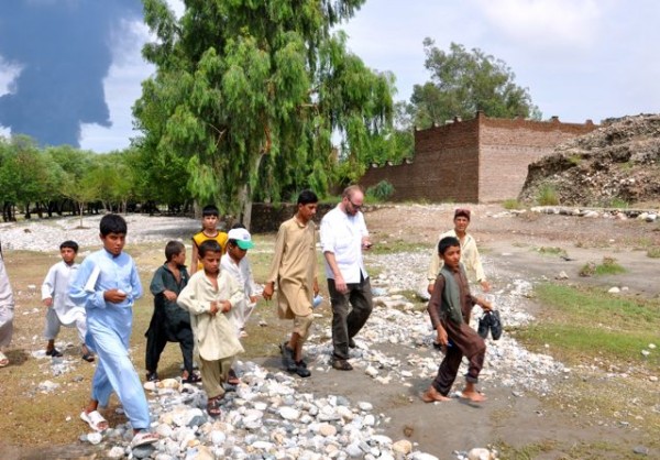 We pushed on - that's The Professor from CHF being escorted by local kids from the village