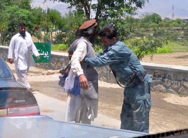 Look at the body language here - the guy getting searched has the classic Taliban look; long hair, untrimmed beard, Pakol and high water pants. 