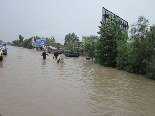 Wednesday 25 July the second "hundred year" flood in less than a year hit Jalalabad following a morning of torrential rain. This is the main road heading towards the airport.