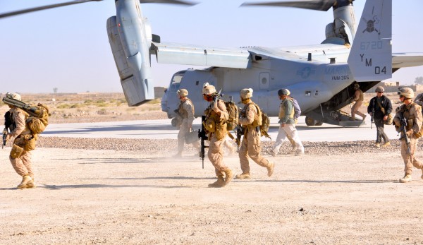 The security element fans out - the Marine in the center is carrying an M-240 machinegun as well as his M16A2. Being a machinegunner, an inherently cool job, sucks sometimes