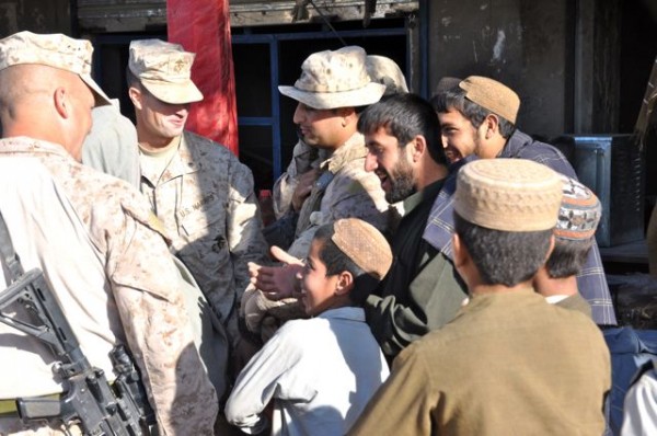 The CO of 2/6, LtCol Kyle Ellison with his boss Col Furness talking to local shop owners in the Marjah Bazaar during his Friday morning walk about. Note the lack of body armor and helmets