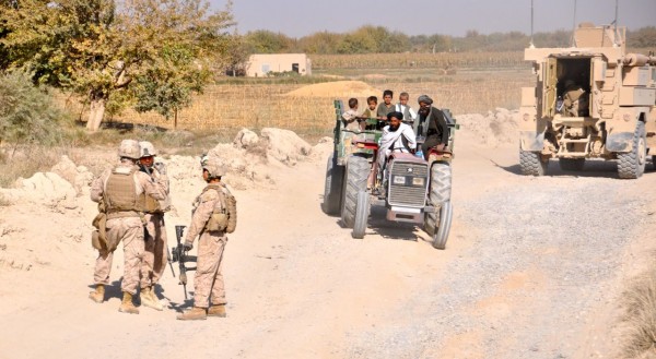 The Marines in all three battalions I was with let civilian traffic pass them while both mounted and dismounted. The old post linked above has a short video of another ISAF unit doing the exact oppisate 