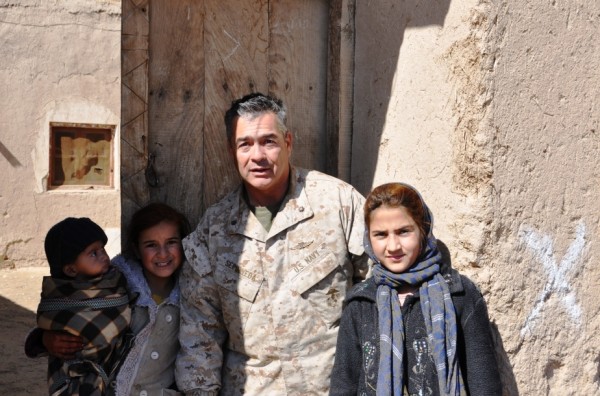 Navy Commander Martin Sepulveda with Zarmina and her sister Sharifa. Zarmina who is 12 or 13 years old is the local school teacher