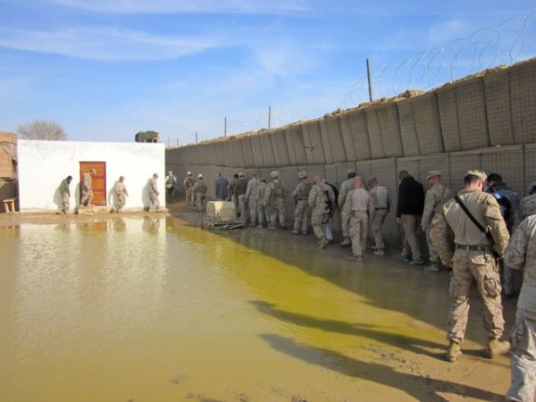 The CODEL heads out to the bazaar. There has been more rain over the past three weeks in Helmand Province then there has been over the previous 3 years. When the congressmen landed one of them asked where the bathrooms were - there are none on this combat outpost just piss tubes inserted into a neutral corner and three wooden boxes with toilet seats bolted on them. Piss tubes and thunder boxes - things congressmen will not soon forget. 