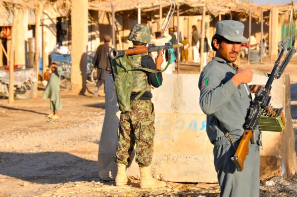 Men will take significant risks to reduce the loads they carry into battle. The ANA soilder in the background and his ANP counterpart if the foreground have just been in contact with the Taliban but they remain as light as they can possibly be 