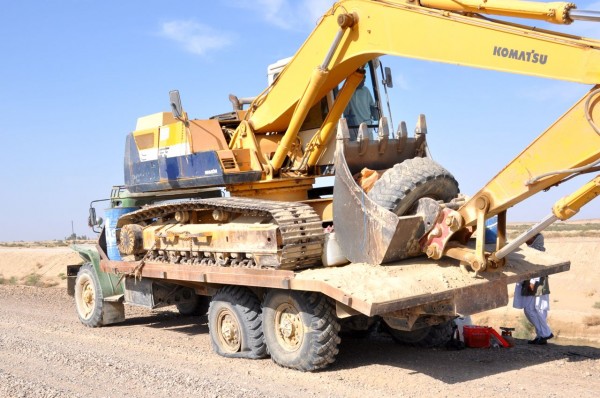 This is typical - I foolishly decided to help supervise the movement of 11 excavators across 100 kilometers of the Dasht-e margo (desert of death). Our first mobility kill occurred 5 kilometers outside Zarnaj. It was downhill from there. 110 degrees, bright sunshine, heavy equipment stalled on old prime movers as far as the eye could see. 3 cups of tea my ass