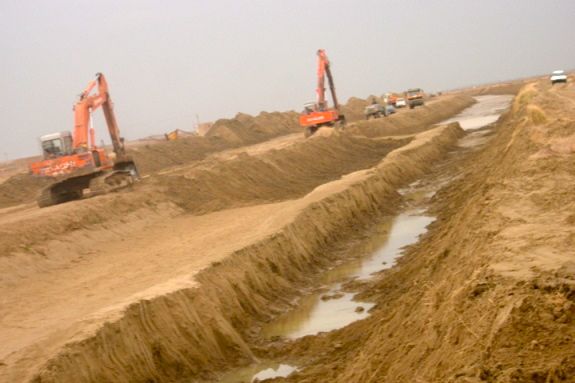 The canal was not all dug by hand - we rented every excavator in the Province too for the harder sections of the canal