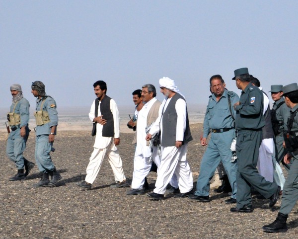 Governor Barahwi walking along with the Provincial Chief of Police and Haji the Chief of the Highway Police and the man who fought his way out of the ambush last week is directly on the Governor's left